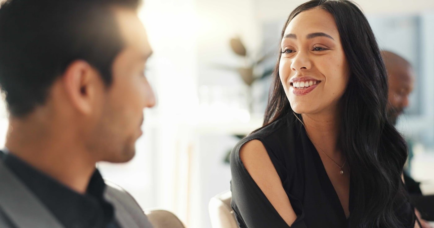 Couple reviewing a document together while discussing immigration planning